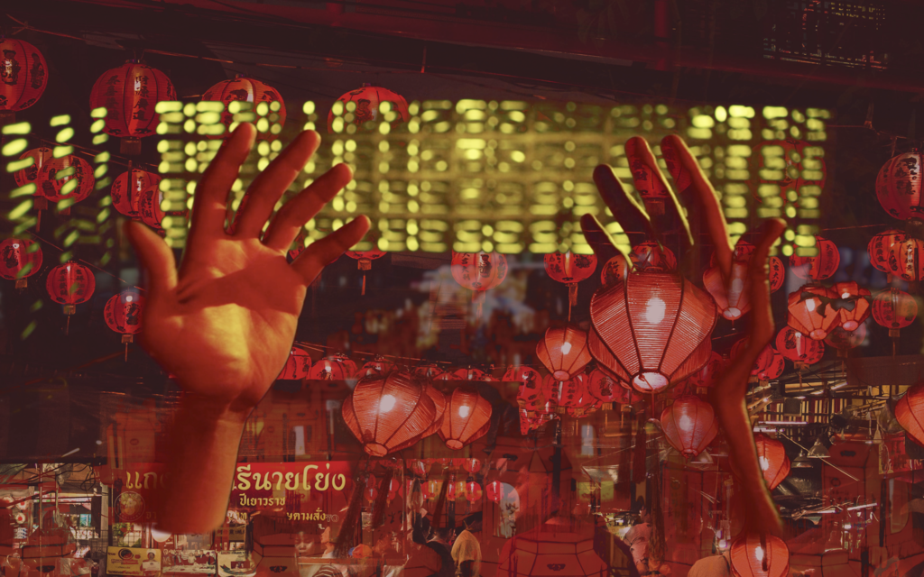 Photo of red lanterns with hands.