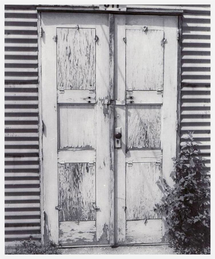 black and white photo of a door
